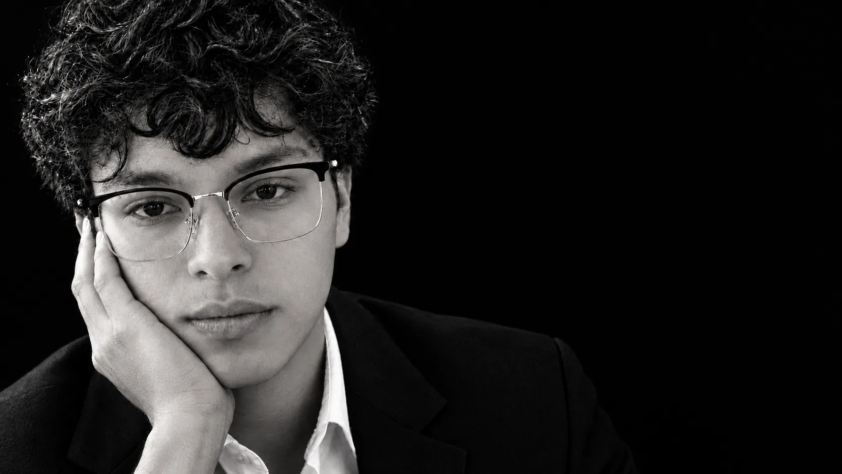Ramon Leon, founder of Lanchester, in black and white, chin resting on his hand.